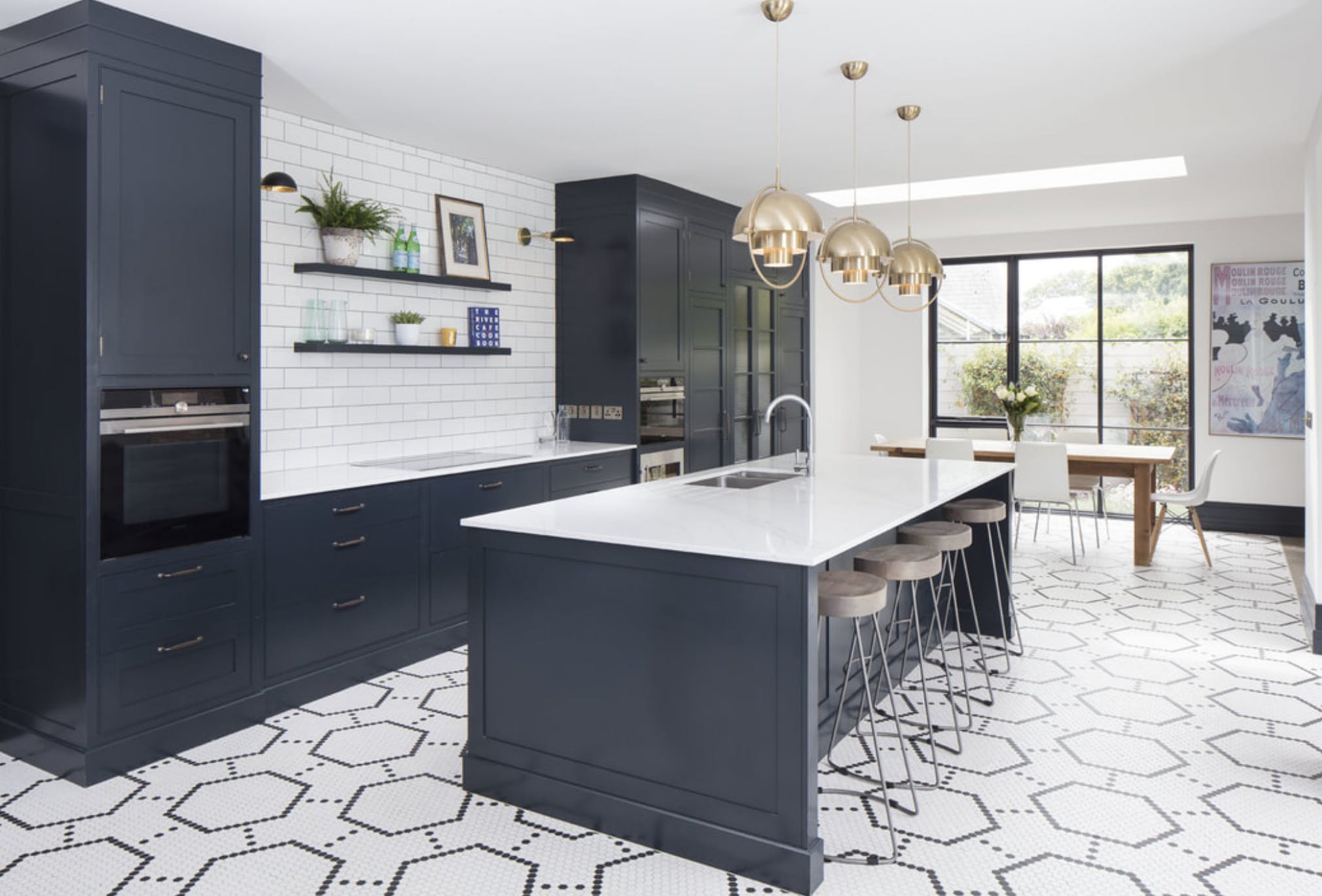 Kitchen design - navy Shaker style kitchen with white worktops
