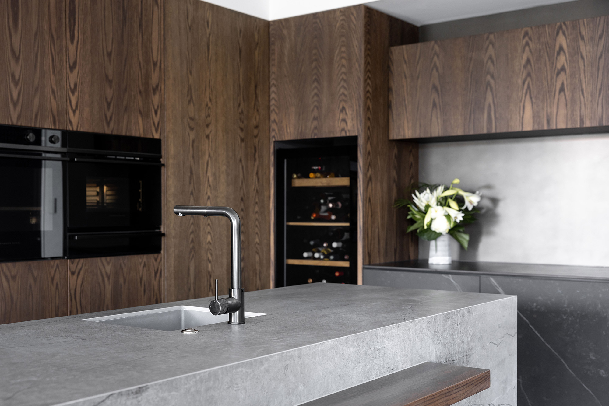 Image of Gulf Harbour 16 in Two Dekton colours to match wood in kitchens and bathrooms - Cosentino
