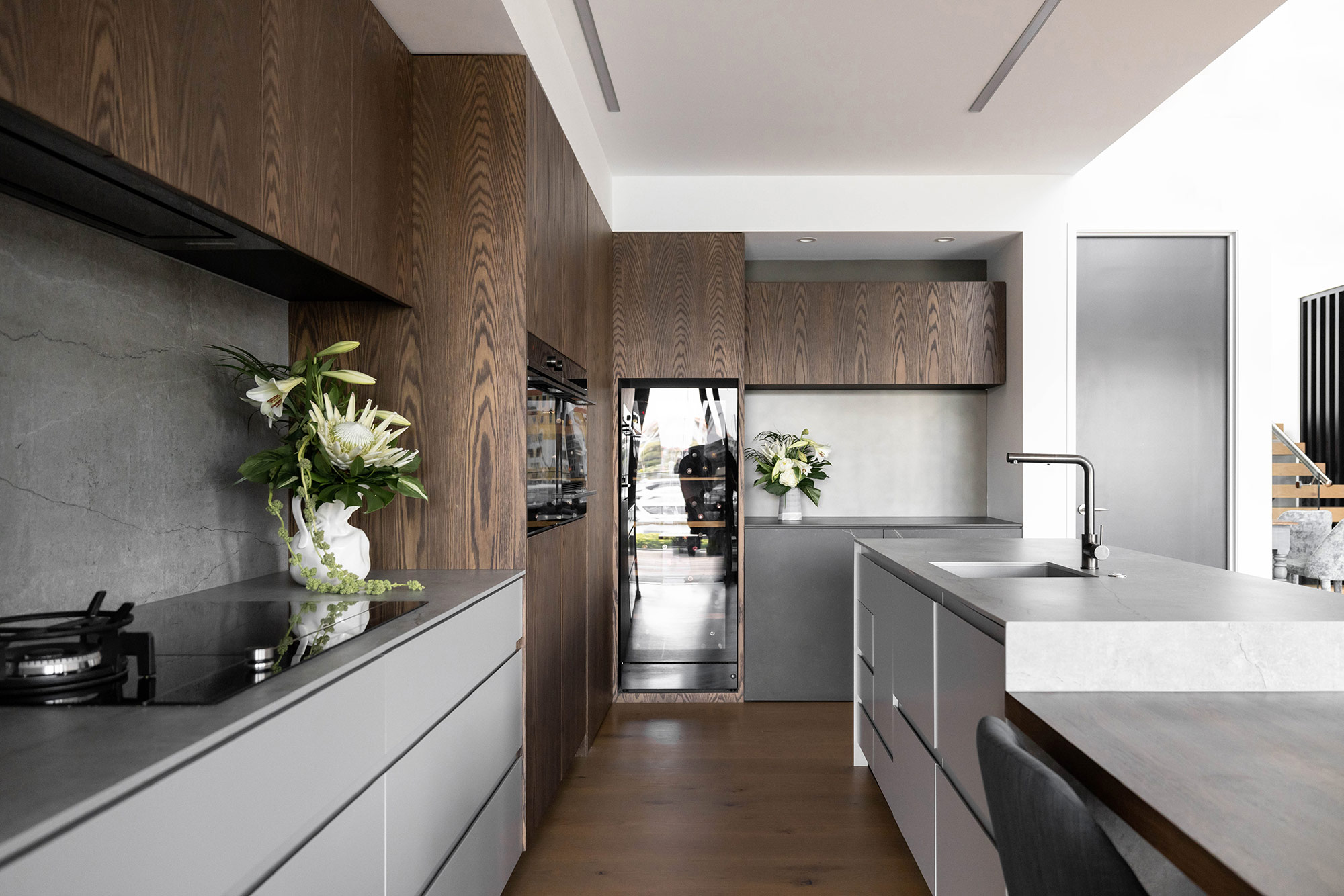 Image of Gulf Harbour 18 in Two Dekton colours to match wood in kitchens and bathrooms - Cosentino