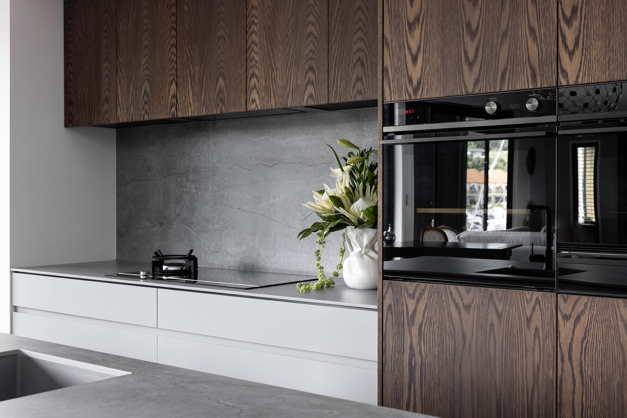 Image of Gulf Harbour 19 in Two Dekton colours to match wood in kitchens and bathrooms - Cosentino